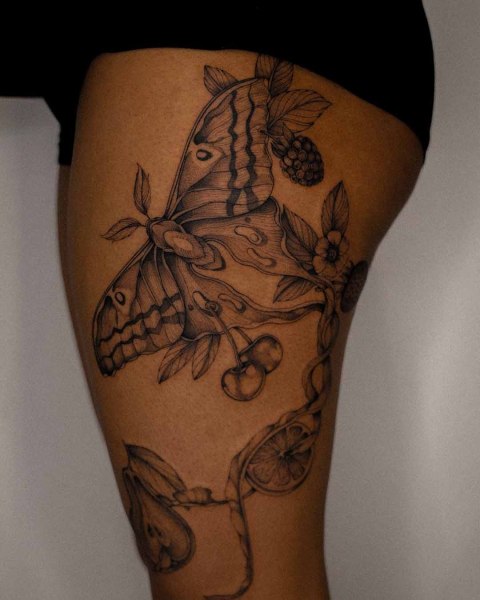 Fine line moth and fruit tattoo by Dominika at Silent Moon, our private tattoo studio in Bermondsey, South East London.