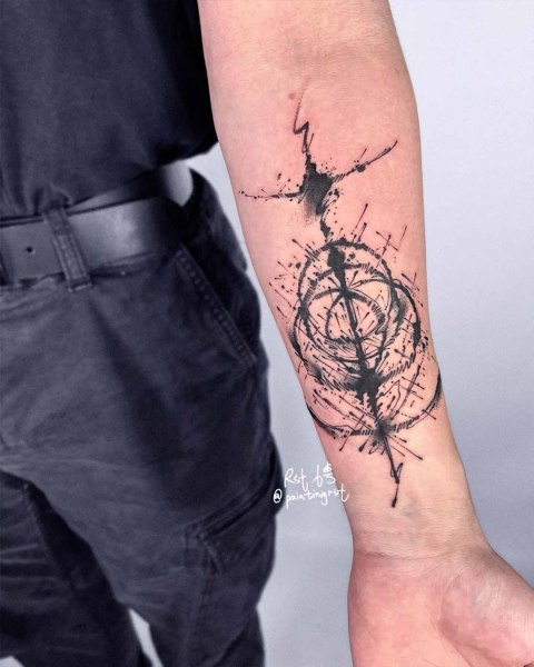 Abstract ink splatter forearm tattoo by guest artist Peng at Silent Moon, our private tattoo studio in Bermondsey, South East London.