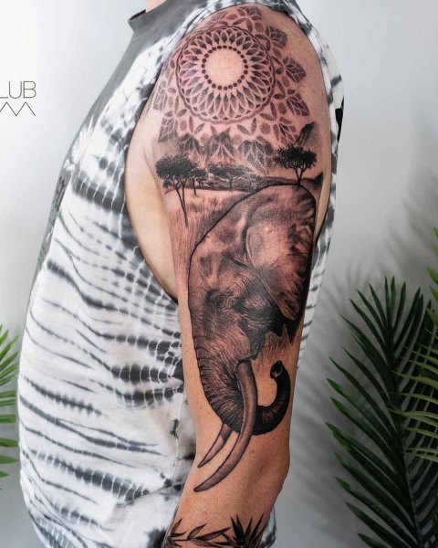 Black and grey realism African elephant half sleeve by Lubava at Silent Moon, our private tattoo studio in Bermondsey, South East London.
