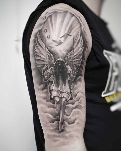 Black and grey realism angel on a swing tattoo by Klaudia at Silent Moon, our private tattoo studio in Bermondsey, South East London.