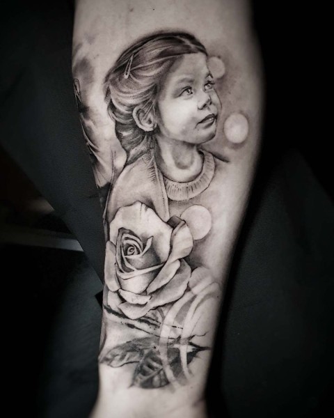 Black and grey realism child portrait tattoo by Klaudia at Silent Moon, our private tattoo studio in Bermondsey, South East London.