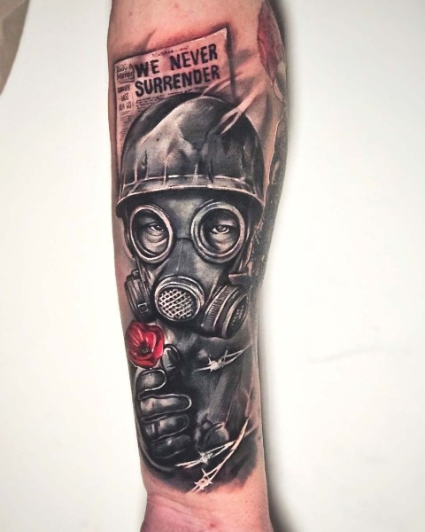 Black and grey realism remembrance tattoo with a red poppy by Klaudia at Silent Moon, our private tattoo studio in Bermondsey, South East London.