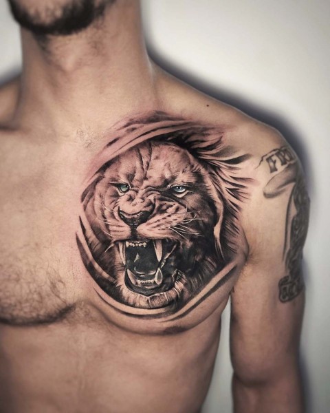 Black and grey realism roaring lion tattoo by Klaudia at Silent Moon, our private tattoo studio in Bermondsey, South East London.