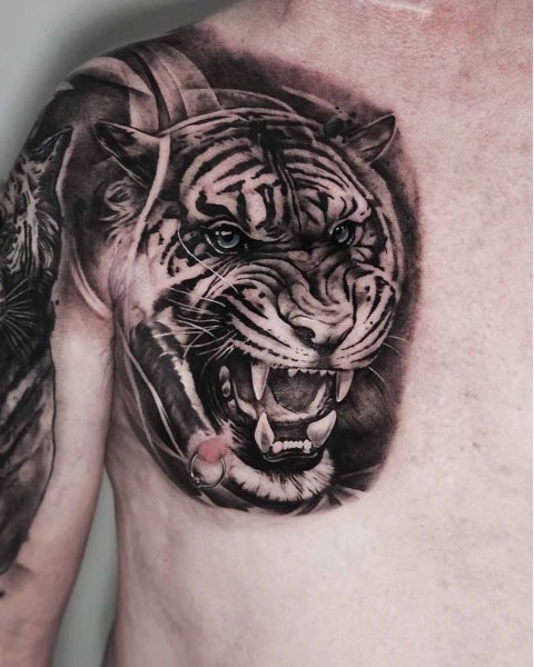 Black and grey realism snarling tiger tattoo by Klaudia at Silent Moon, our private tattoo studio in Bermondsey, South East London.
