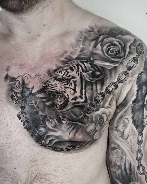 Black and grey realism tiger and broken chain chest tattoo by Klaudia at Silent Moon, our private tattoo studio in Bermondsey, South East London.