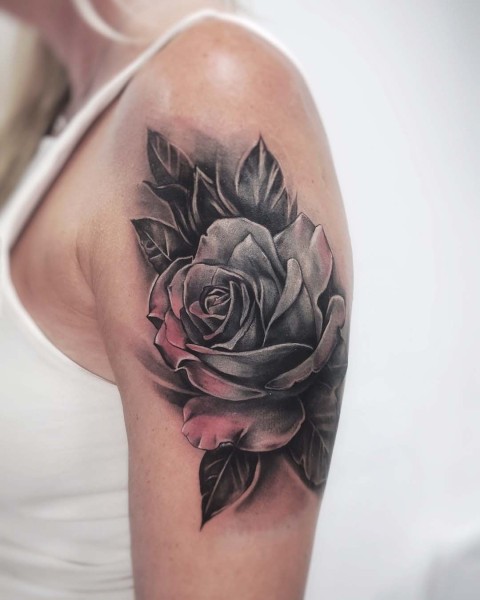Realism rose tattoo with soft pink highlights by Klaudia at Silent Moon, our private tattoo studio in Bermondsey, South East London.