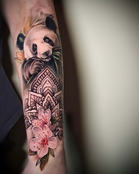 Realism panda tattoo with mandala and cherry blossoms by Klaudia at Silent Moon, our private tattoo studio in Bermondsey, South East London.