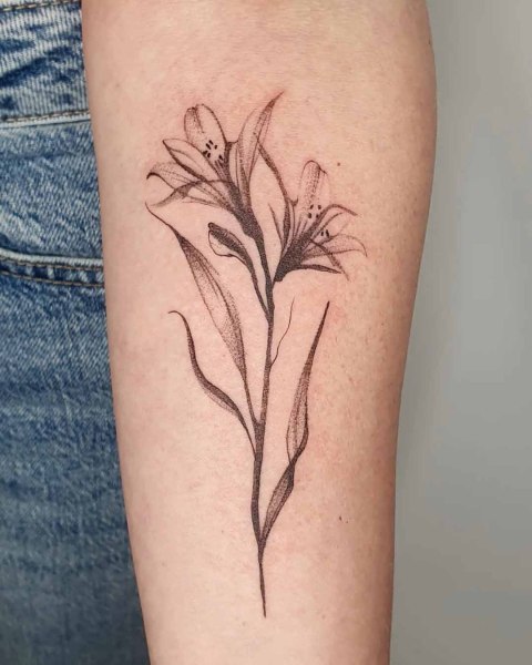 Fine line lily forearm tattoo by Robin at Silent Moon, our private tattoo studio in Bermondsey, South East London.