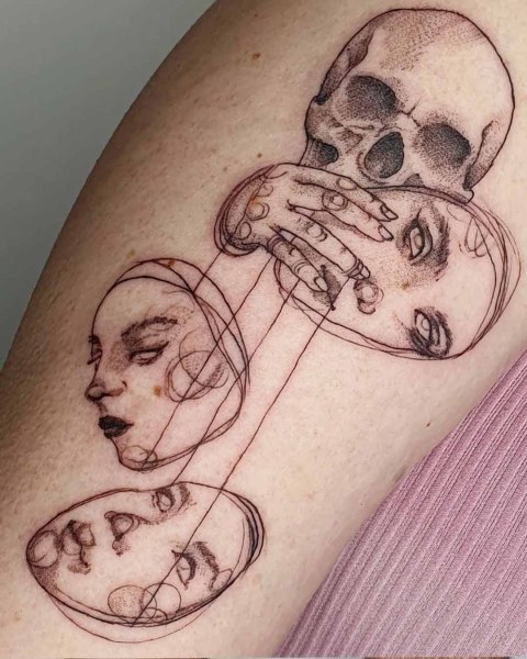 Surreal sketch style skull and faces tattoo by Robin at Silent Moon, our private tattoo studio in Bermondsey, South East London.