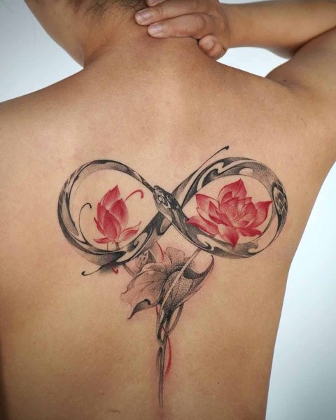 Infinity snake and red lotus back tattoo by Satrxx at Silent Moon, our private tattoo studio in Bermondsey, South East London.
