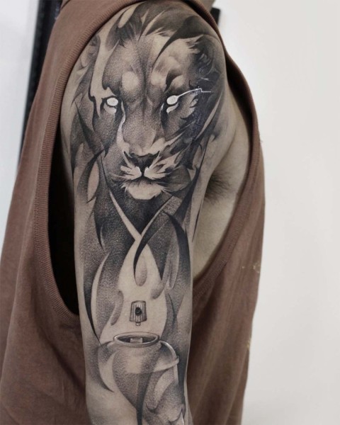 Black and grey lion half sleeve tattoo by Satrxx at Silent Moon, our private tattoo studio in Bermondsey, South East London.