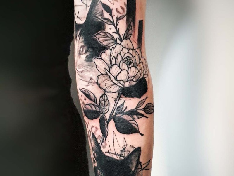 Abstract cat portrait tattoo with a peony and leopard print by Klaudia at Silent Moon, our private tattoo studio in Bermondsey, South East London.