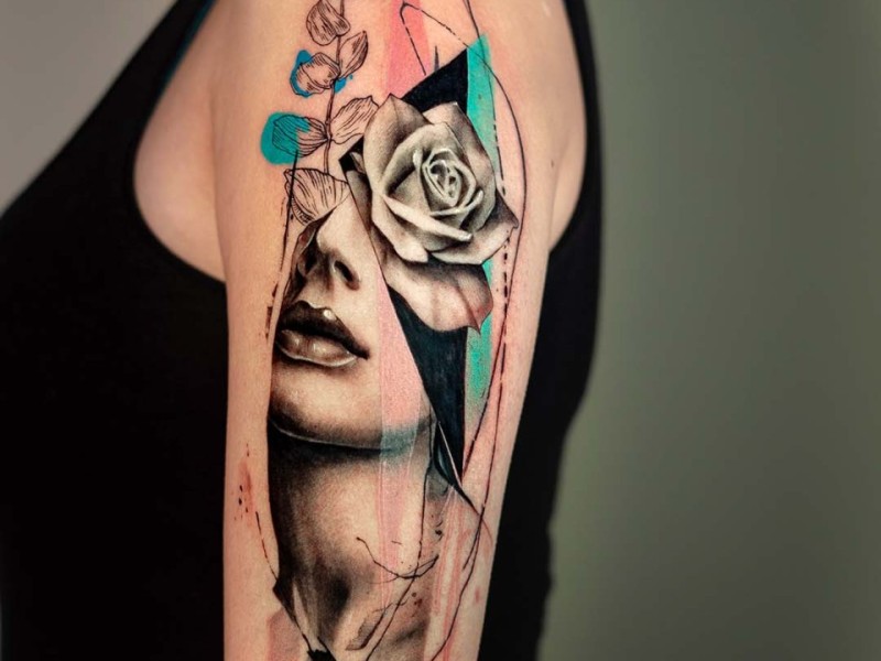 Abstract woman's face and rose tattoo by Klaudia at Silent Moon, our private tattoo studio in Bermondsey, South East London.
