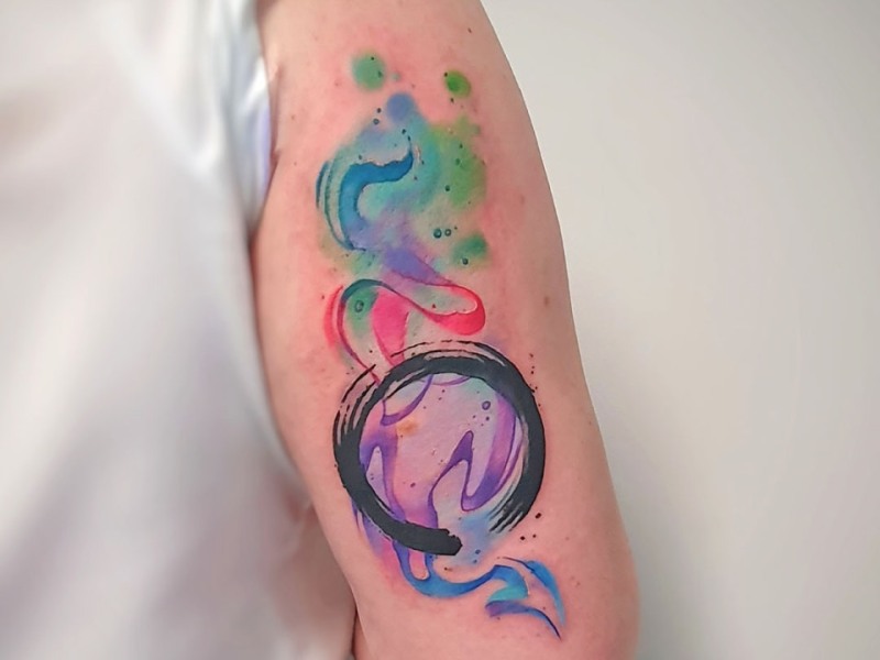 Abstract watercolour ensō circle tattoo by Klaudia at Silent Moon, our private tattoo studio in Bermondsey, South East London.