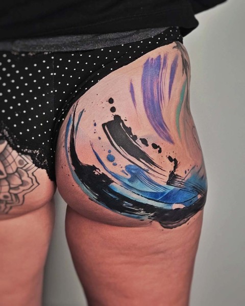 Abstract watercolour brush stroke tattoo by Klaudia at Silent Moon, our private tattoo studio in Bermondsey, South East London.