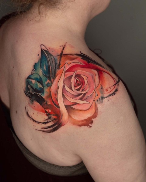 Watercolour coral rose tattoo with black brush strokes by Klaudia at Silent Moon, our private tattoo studio in Bermondsey, South East London.