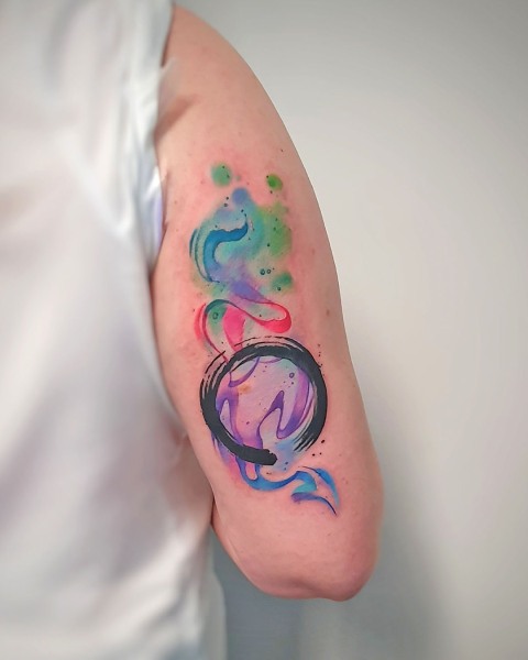 Abstract watercolour ensō circle tattoo by Klaudia at Silent Moon, our private tattoo studio in Bermondsey, South East London.