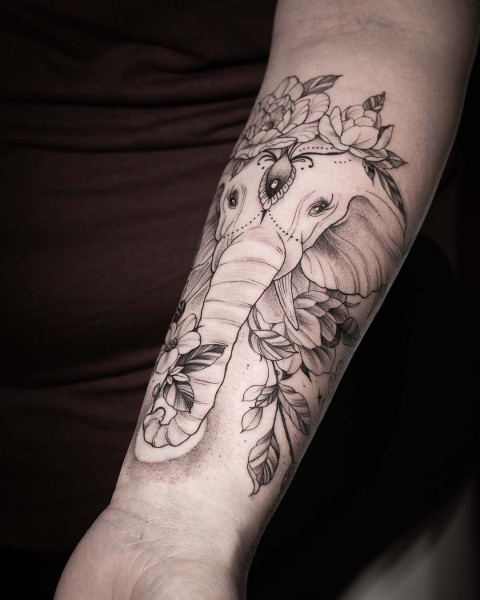 Fine line elephant and floral tattoo by Klaudia at Silent Moon, our private tattoo studio in Bermondsey, South East London.