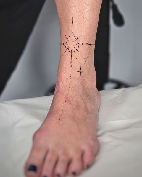 Fine line ornamental anklet tattoo by Klaudia at Silent Moon, our private tattoo studio in Bermondsey, South East London.