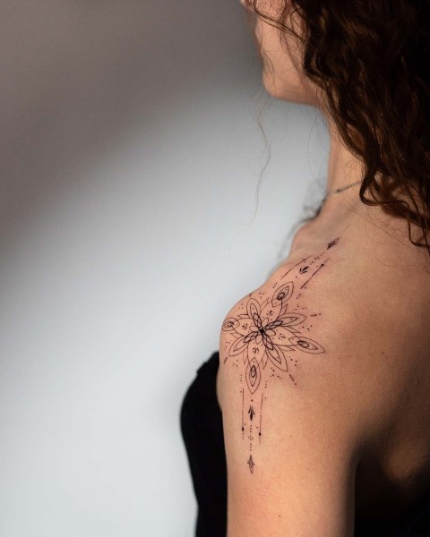 Fine line ornamental mandala shoulder tattoo by Klaudia at Silent Moon, our private tattoo studio in Bermondsey, South East London.