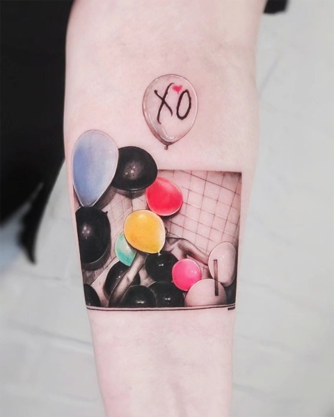 Micro-realism balloon tattoo by Klaudia at Silent Moon, our private tattoo studio in Bermondsey, South East London.