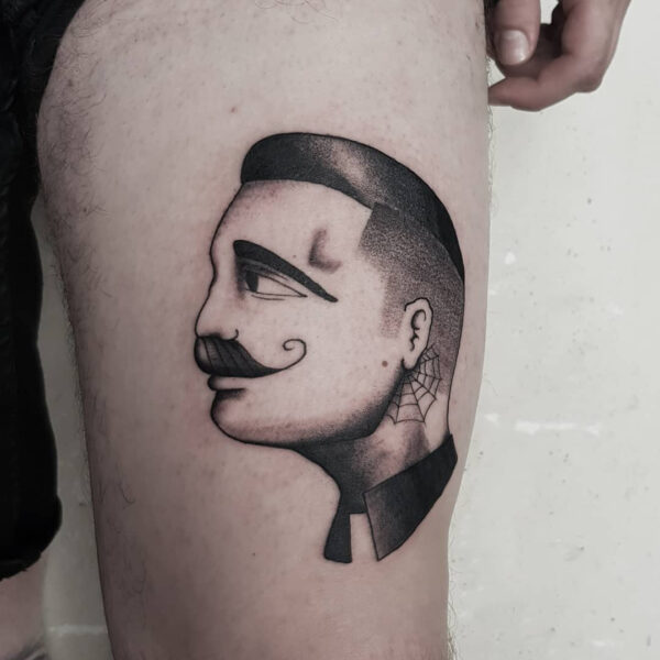 British men head with moustache dotwork tattoo on men thigh