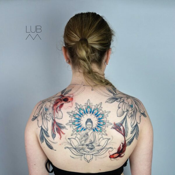Large custom back tattoo of Buddha seated on a lotus flower, framed by koi fish, black and grey flowers, and a detailed blue colour mandala. Spiritual illustrative tattoo by Silent Moon Tattoo Studio London UK.