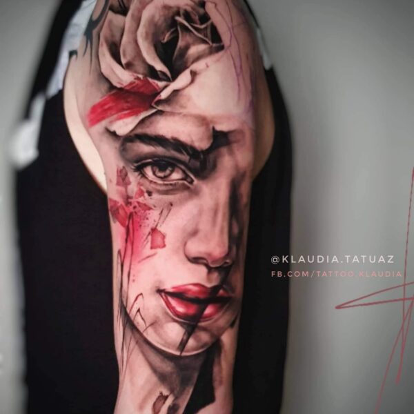 Abstract Realism Portrait & Rose Tattoo | Dramatic Colourwork | Silent Moon London Dramatic colour realism portrait tattoo on shoulder with large grey rose, red lipstick, and abstract painterly strokes. Custom realism tattooed at Silent Moon Tattoo Studio London.