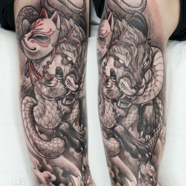 Japanese-style leg tattoo featuring tiger, snake, and kitsune mask by tattoo artist at Silent Moon Tattoo Studio in London.
