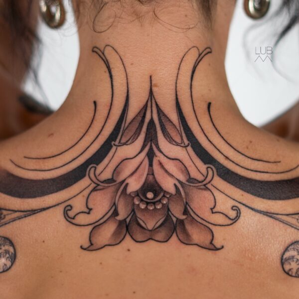 Ornamental black and grey neck tattoo with floral and geometric details by tattoo artist at Silent Moon Tattoo Studio in London.